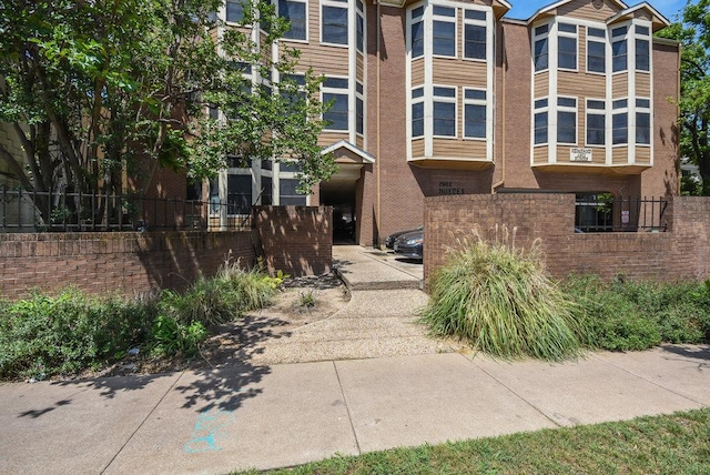view of building exterior with fence