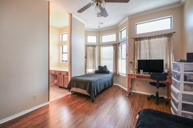bedroom featuring ornamental molding, wood finished floors, and multiple windows