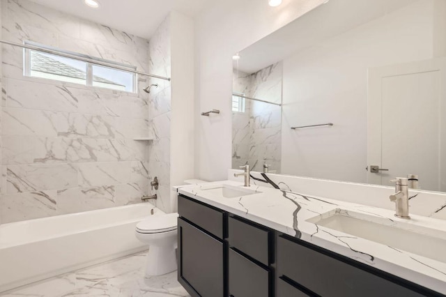 bathroom featuring double vanity, a sink, marble finish floor, and toilet