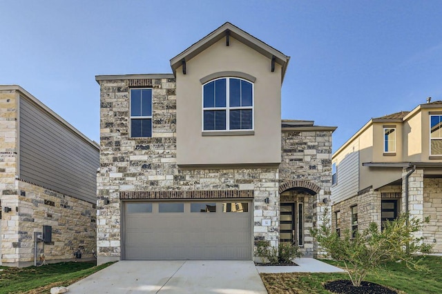 view of front of house featuring an attached garage, stucco siding, stone siding, and concrete driveway