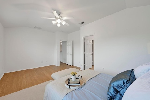 9201 Brodie Ln Unit 2001, Austin, TX 78748 - bedroom with vaulted ceiling, wood finished floors, and ceiling fan