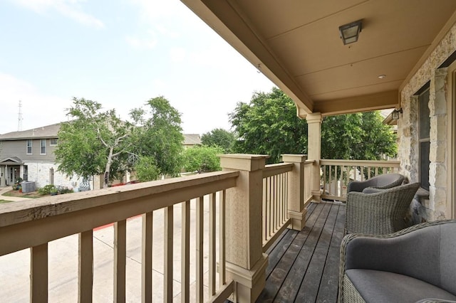 wooden terrace featuring central air condition unit