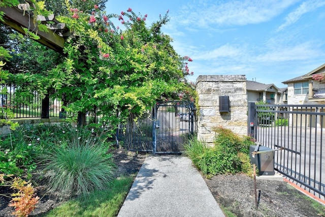view of gate with fence