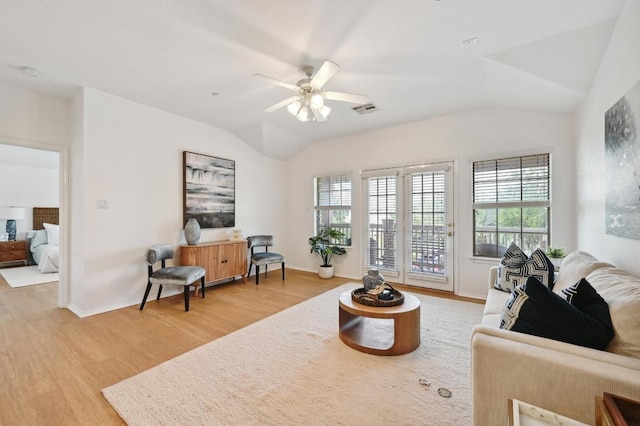 9201 Brodie Ln Unit 2001, Austin, TX 78748 - living area featuring vaulted ceiling, light wood finished floors, healthy amount of natural light, and ceiling fan
