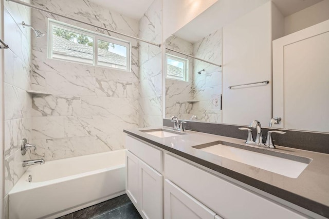bathroom featuring double vanity, a sink, and bathtub / shower combination