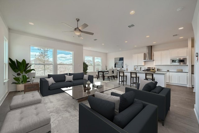 1531 N Red Bud Ln Unit 29, Round Rock, TX 78665 - living room with ceiling fan, light wood-style flooring, and recessed lighting