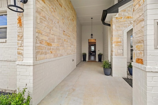 entrance to property with brick siding