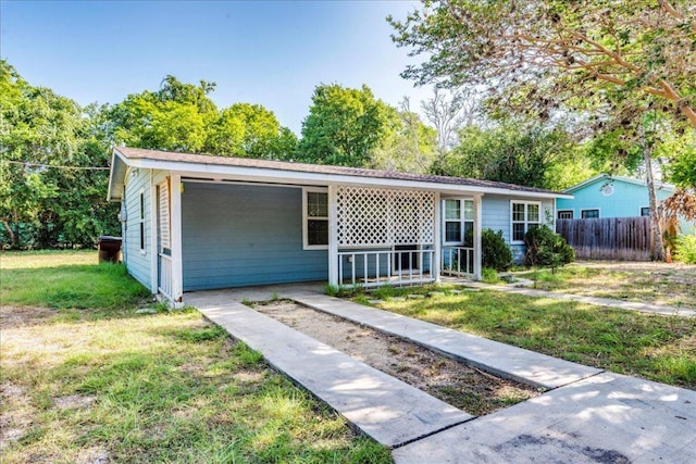 ranch-style house with a front lawn and fence