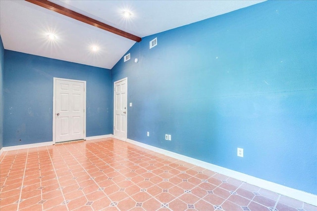 spare room with baseboards, vaulted ceiling with beams, and visible vents