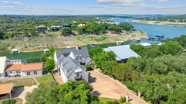 birds eye view of property with a residential view and a water view