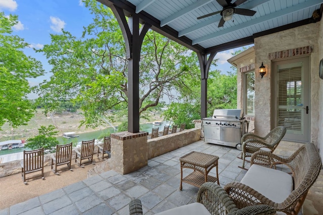 view of patio featuring a ceiling fan and a grill