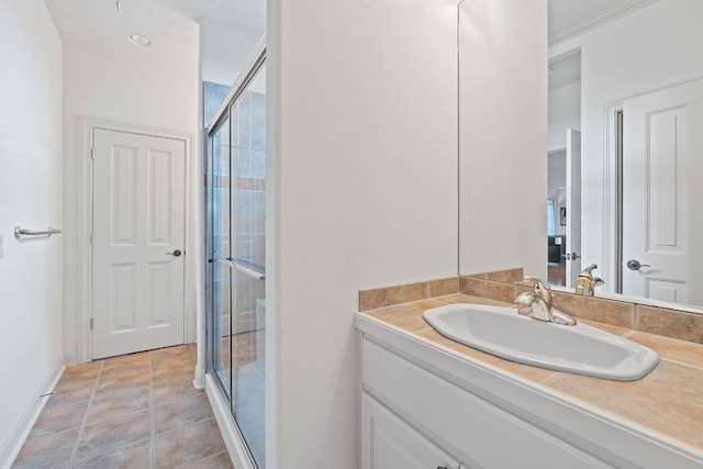 bathroom featuring vanity and a shower stall