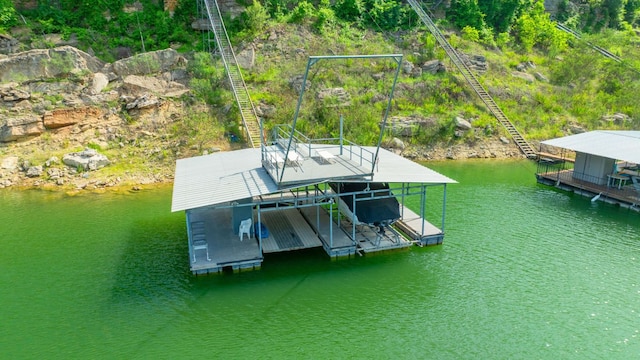 view of dock featuring a water view and boat lift