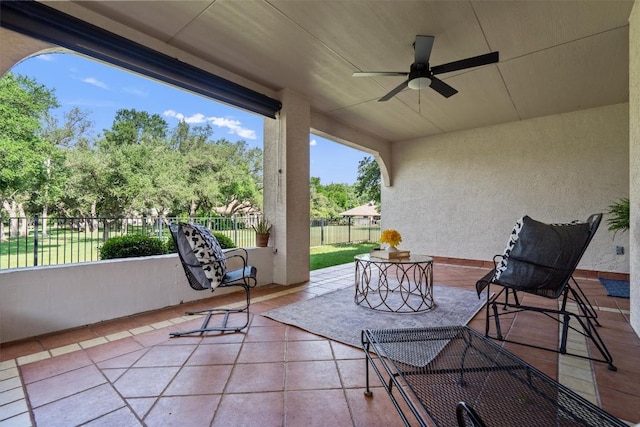 exterior space featuring tile patterned floors and a textured wall
