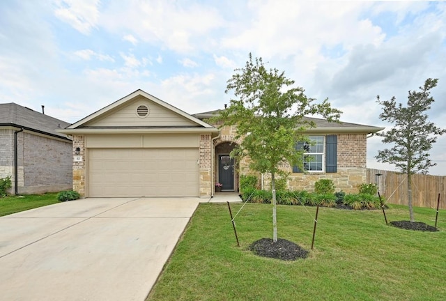 ranch-style home featuring a front lawn, fence, stone siding, concrete driveway, and an attached garage