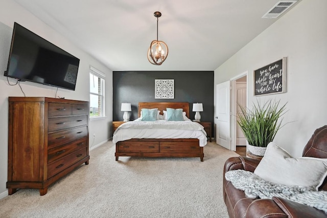 bedroom featuring visible vents, baseboards, a notable chandelier, and light carpet