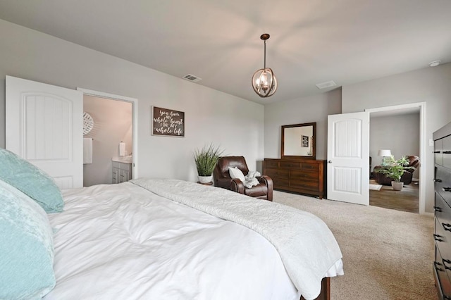 carpeted bedroom with a chandelier and visible vents