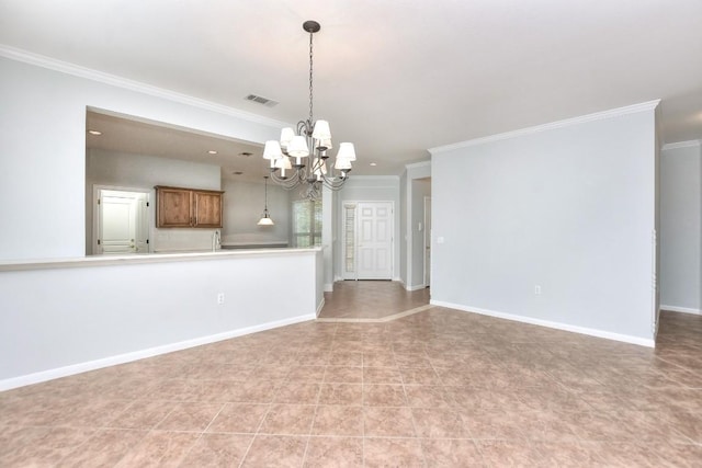empty room featuring crown molding, baseboards, a chandelier, and visible vents