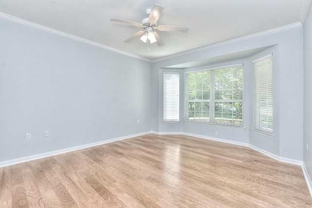 empty room with baseboards, ornamental molding, light wood finished floors, and ceiling fan