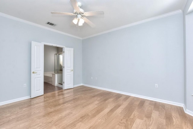 unfurnished bedroom with visible vents, ornamental molding, light wood-style floors, and baseboards