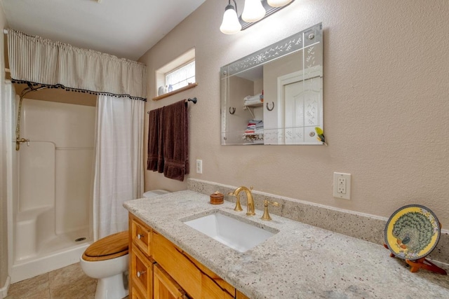 full bathroom with vanity, toilet, and a stall shower