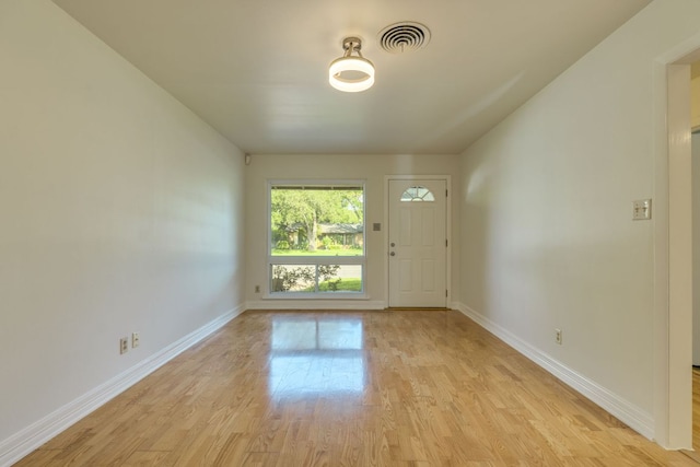 8504 Burrell Dr, Austin, TX 78757 - entryway with baseboards and light wood-style flooring