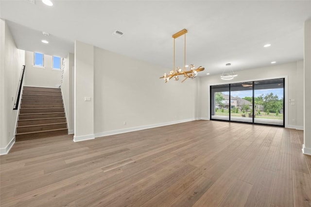unfurnished living room with recessed lighting, baseboards, visible vents, and light wood-style flooring