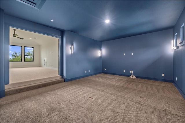 empty room with baseboards, carpet flooring, and recessed lighting