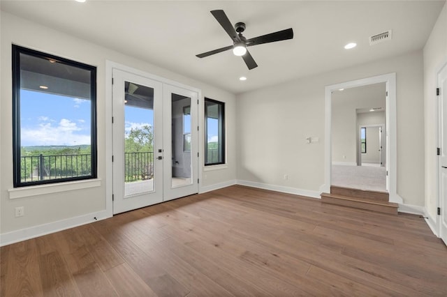 3202 Winding Creek Cv, Austin, TX 78735 - spare room with french doors, wood finished floors, ceiling fan, and recessed lighting