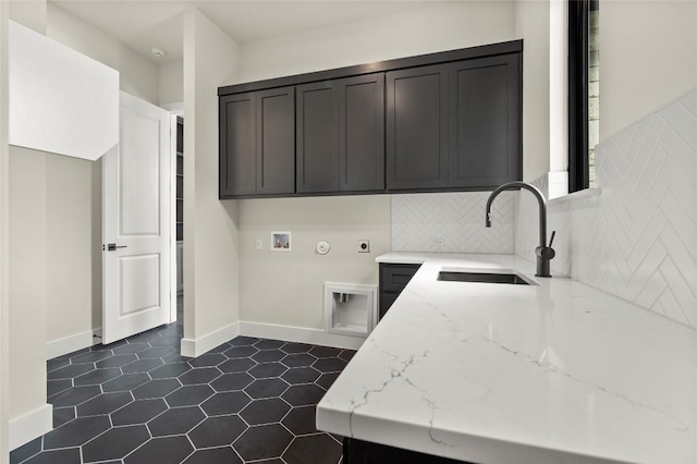 3202 Winding Creek Cv, Austin, TX 78735 - laundry room featuring cabinet space, hookup for an electric dryer, dark tile patterned floors, and hookup for a washing machine