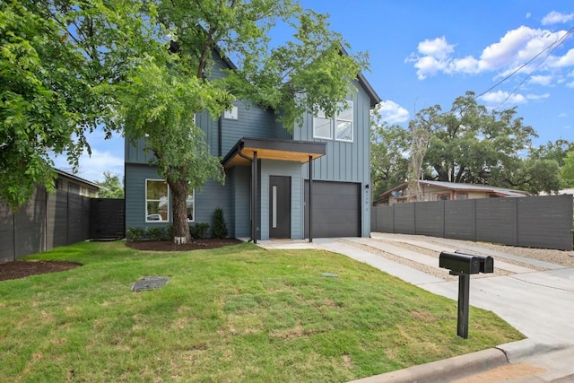 6110 Atwood St Unit 1, Austin, TX 78741 - contemporary house featuring board and batten siding, fence, and driveway