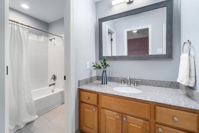 bathroom with vanity, tile patterned flooring, and shower / bath combo