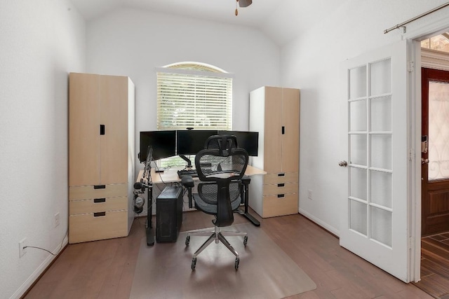 2229 Sauterne Dr, Leander, TX 78641 - home office featuring baseboards, vaulted ceiling, and wood finished floors