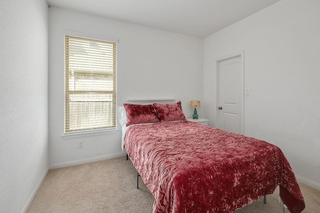 2229 Sauterne Dr, Leander, TX 78641 - bedroom featuring baseboards, multiple windows, and light carpet