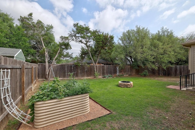 2229 Sauterne Dr, Leander, TX 78641 - view of yard with a fenced backyard and an outdoor fire pit