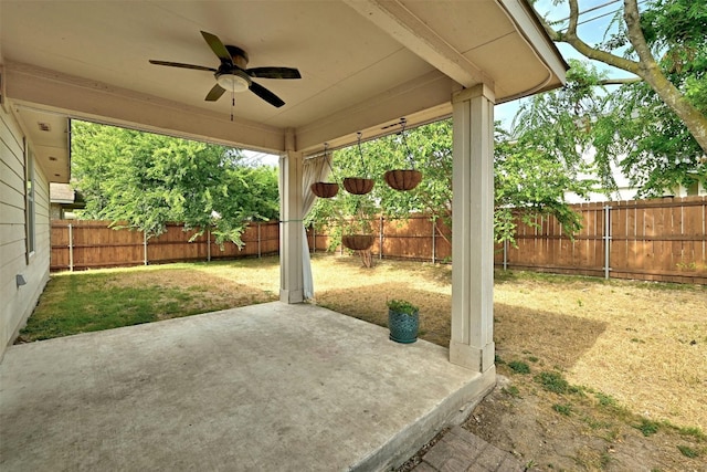 view of patio / terrace featuring a fenced backyard and a ceiling fan
