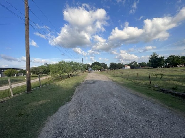 9507 Capitol View Dr, Austin, TX 78747 - view of street featuring a rural view and gravel driveway
