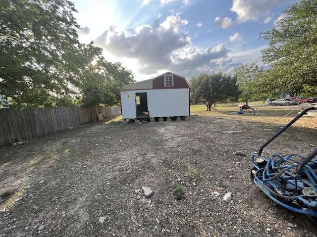 9507 Capitol View Dr, Austin, TX 78747 - view of yard with fence, a storage unit, and an outbuilding