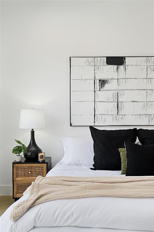 bedroom with wood finished floors