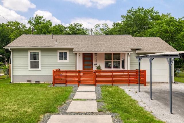 ranch-style home featuring a porch, a shingled roof, fence private yard, and a front yard