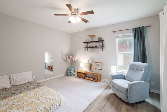 bedroom with baseboards and a ceiling fan