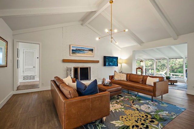 living room featuring lofted ceiling with beams, a brick fireplace, wood finished floors, and a notable chandelier