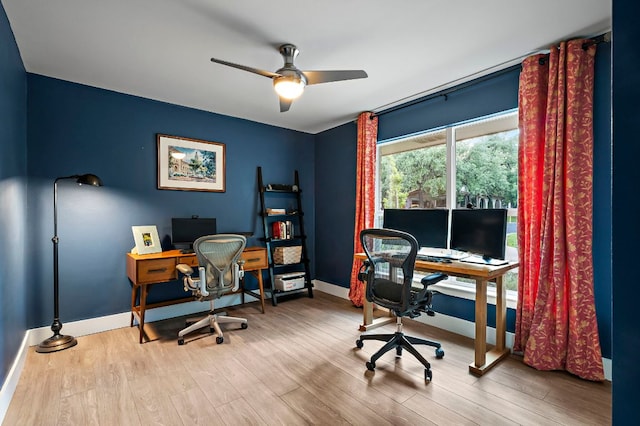 home office featuring baseboards, ceiling fan, and wood finished floors