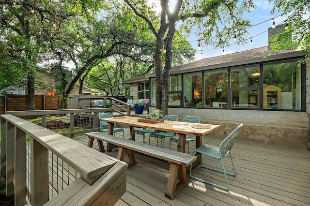 wooden deck featuring fence and outdoor dining area