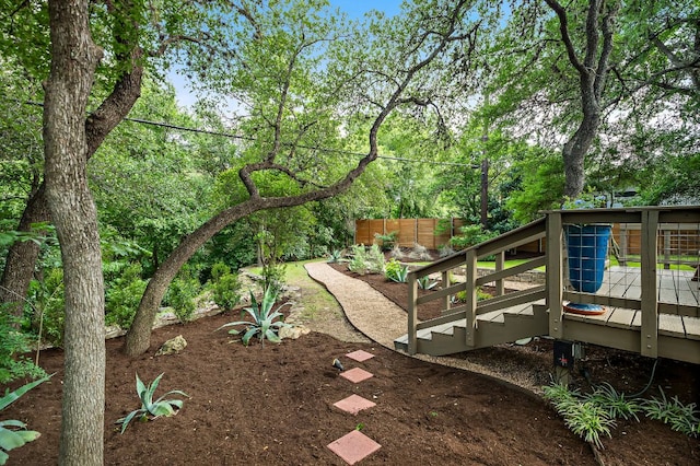 view of yard with fence and a deck