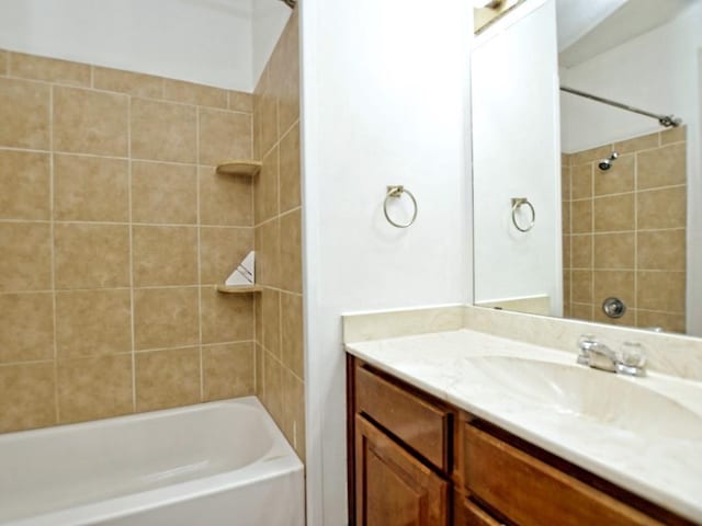 bathroom featuring vanity and shower / bathtub combination