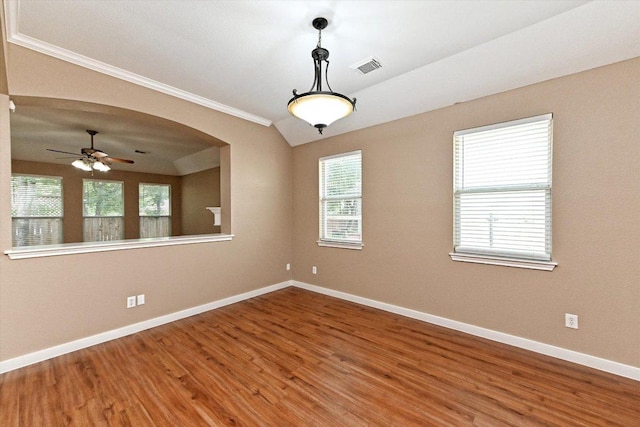 3705 Derby Trl, Round Rock, TX 78681 - unfurnished room with wood finished floors, crown molding, a ceiling fan, lofted ceiling, and arched walkways