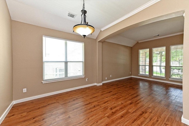 3705 Derby Trl, Round Rock, TX 78681 - unfurnished room with arched walkways, crown molding, wood finished floors, and vaulted ceiling