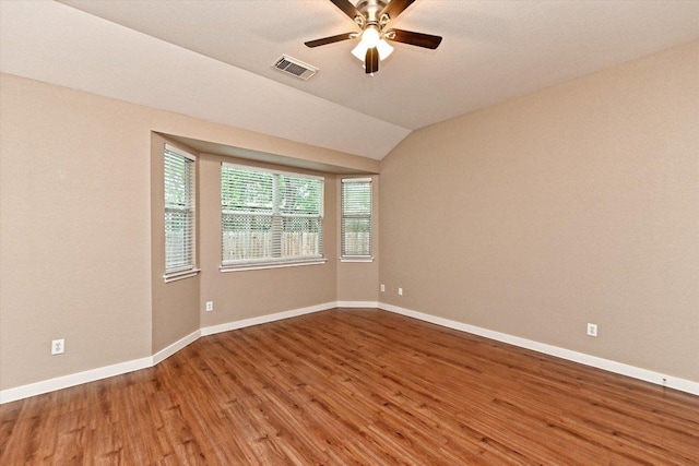 3705 Derby Trl, Round Rock, TX 78681 - empty room with wood finished floors, a ceiling fan, and vaulted ceiling