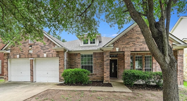 3705 Derby Trl, Round Rock, TX 78681 - view of front of home with an attached garage, brick siding, driveway, and a shingled roof